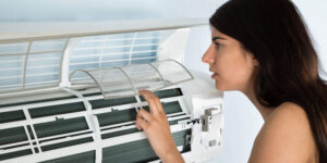 woman smelling burnt airconditioner
